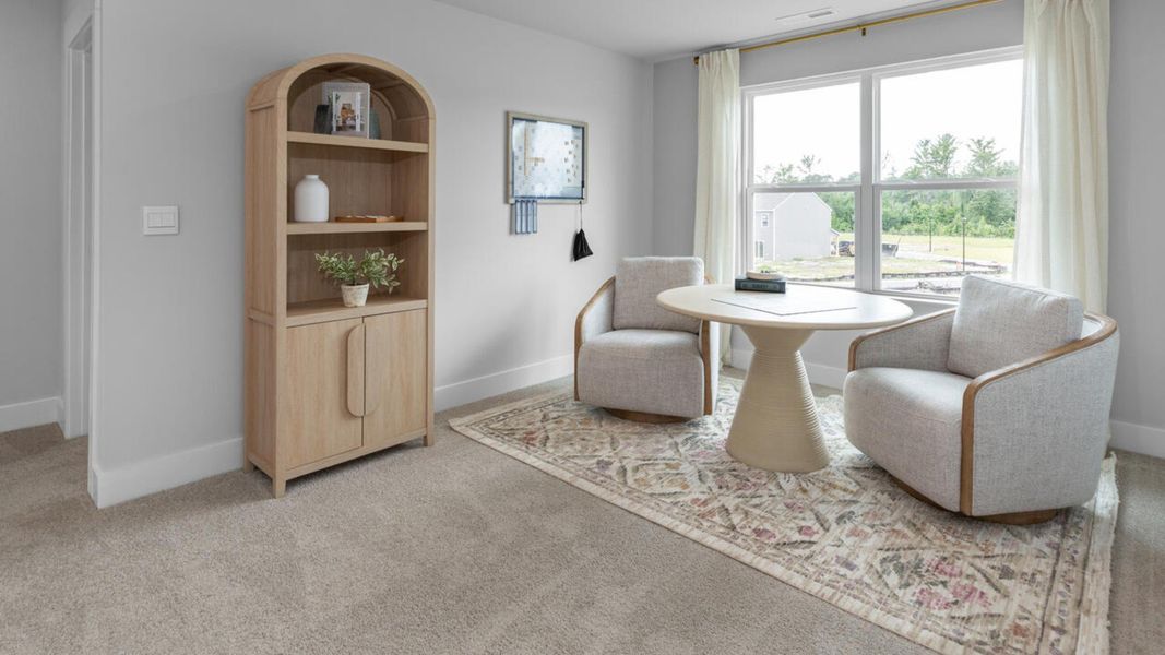 Furnished interior in a model home at Eagle Creek in Bolivia (Image 33).