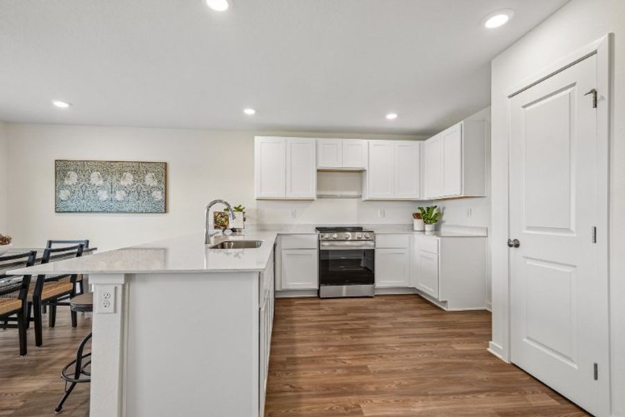 A kitchen with white cabinets. A kitchen with white cabinets.