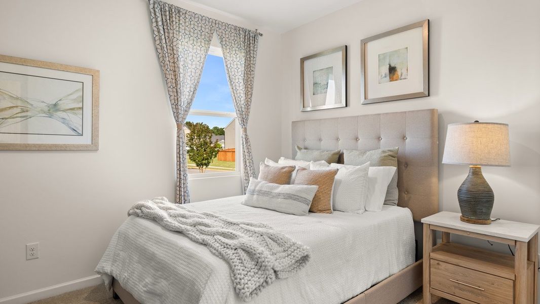 Furnished interior in a model home at Preserve at Dove Creek in Statham (Image 15).