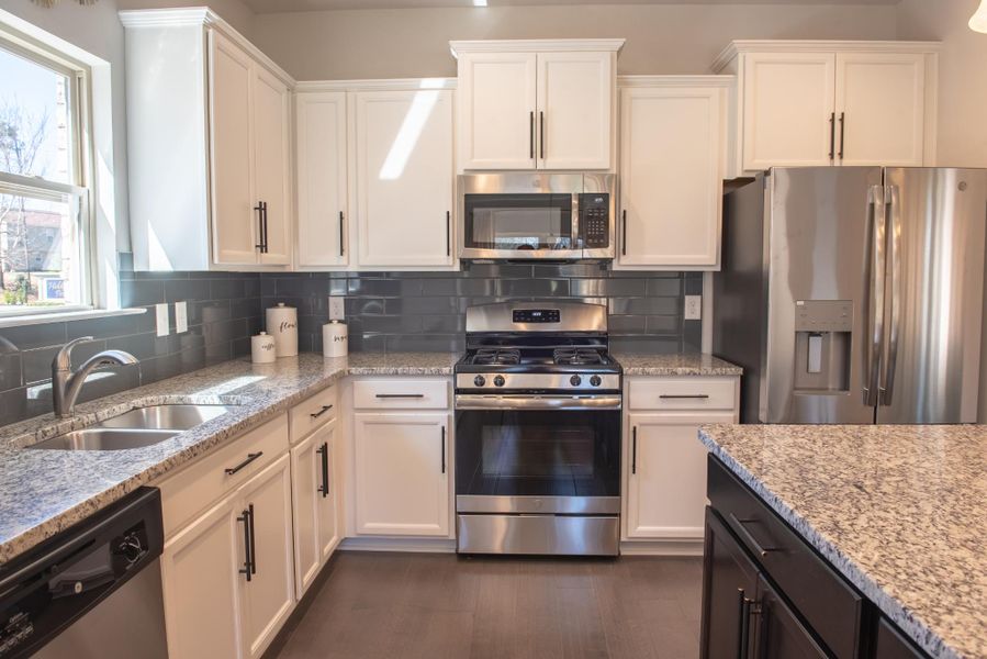 Furnished interior in a model home at Hidden Lake Preserve in Greenville (Image 5).
