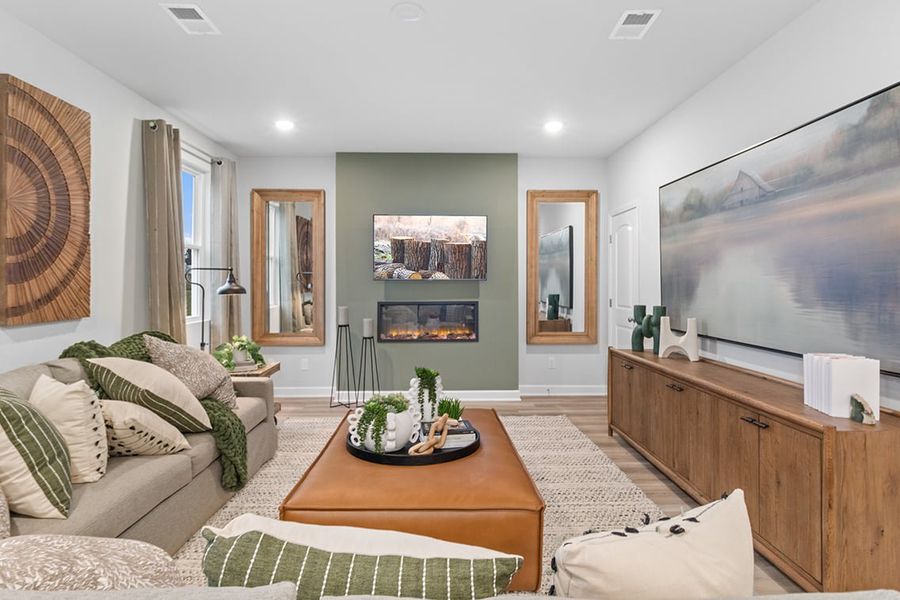 A living room with a large tv. A living room with a large tv.