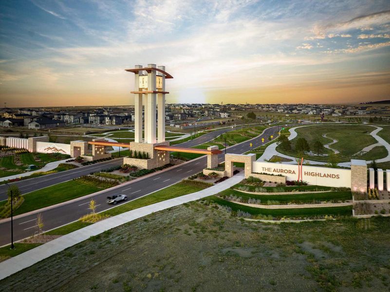 Entrance to the The Aurora Highlands The Signature community in Aurora, CO, featuring signage and landscaping (Image 1).