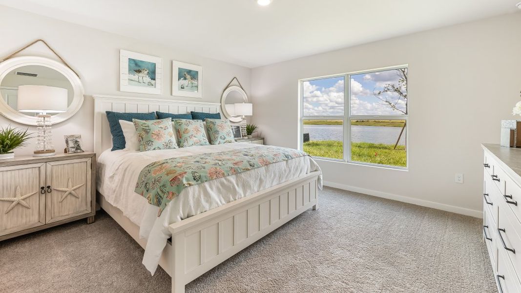 Furnished interior in a model home at Cali Cove in Punta Gorda (Image 20).