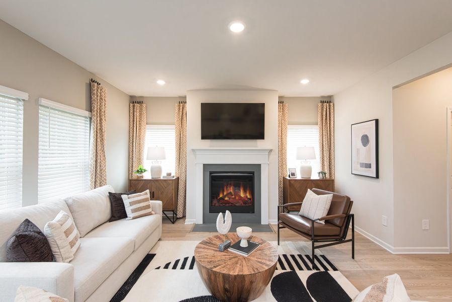 Relax by the fireplace and enjoy a move night in the living room.