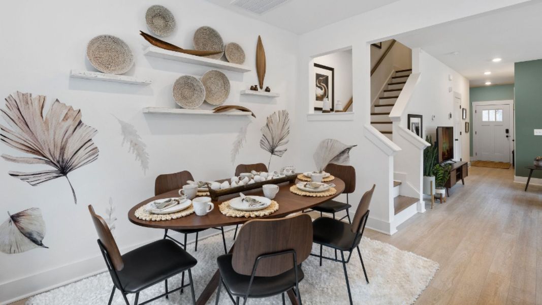 Litchfield design comfortable dining area and open-floor concept. Leigh Park by DRB Homes. Charlotte, NC.