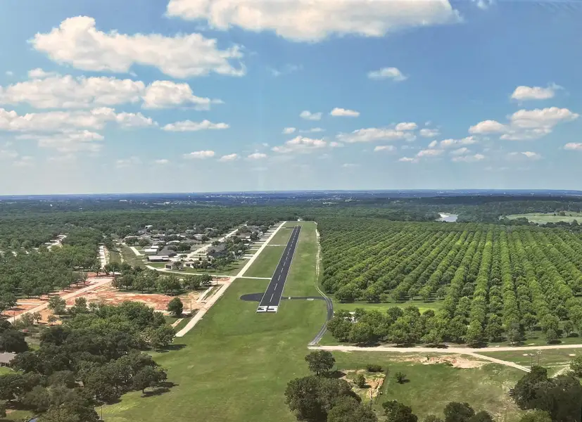 Aerial view of the Pecan Plantation community in Granbury, TX, showing layout and nearby surroundings (Image 1). Aerial view of the Pecan Plantation community in Granbury, TX, showing layout and nearby surroundings (Image 1).