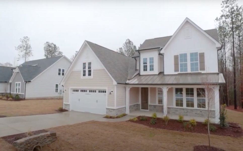 Front exterior of a home in the WyndWater community, located in Hampstead, NC (Image 7).
