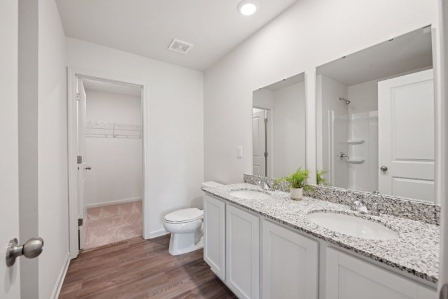 A bathroom with a marble countertop. A bathroom with a marble countertop.
