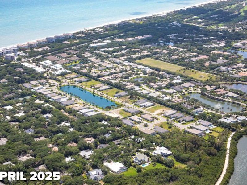 Aerial view of the The Strand community in Vero Beach, FL, showing layout and nearby surroundings (Image 8).