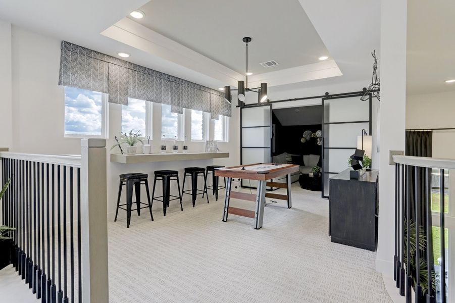 Furnished interior in a model home at Sunterra (Katy ISD) in Katy (Image 12).