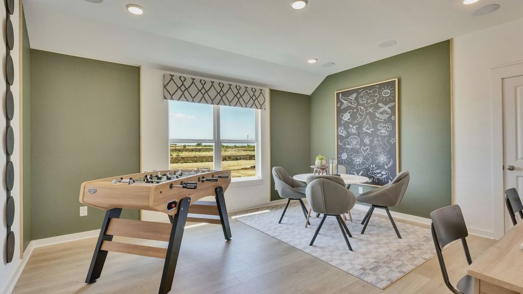 Luxurious game room features chic furnishings, elegant decor, and panoramic views in Hunters Glen. Luxurious game room features chic furnishings, elegant decor, and panoramic views in Hunters Glen.