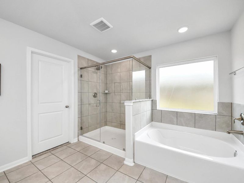 Furnished interior in a model home at Sunterra in Katy (Image 28).