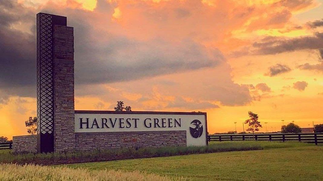 Entrance to the Harvest Green community in Richmond, TX, featuring signage and landscaping (Image 4).