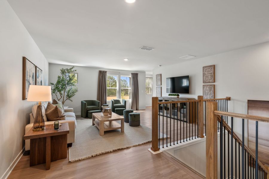 A living room with a wood floor.