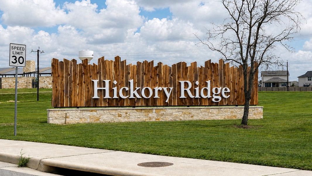 Entrance to the Hickory Ridge community in Elmendorf, TX, featuring signage and landscaping (Image 1). Entrance to the Hickory Ridge community in Elmendorf, TX, featuring signage and landscaping (Image 1).