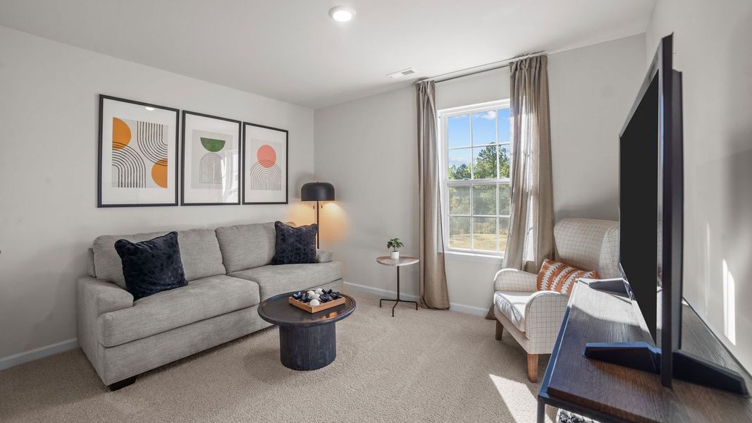 Furnished interior in a model home at Bedford Place in Wilson (Image 7).