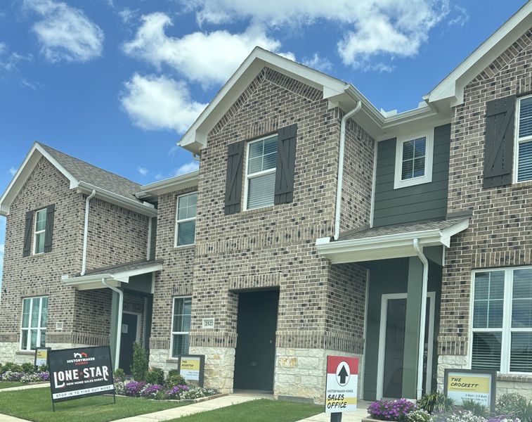 A charming brick townhome with elegant shutters in Seven Oaks Townhomes by HistoryMaker Homes, located in Tomball, TX. A charming brick townhome with elegant shutters in Seven Oaks Townhomes by HistoryMaker Homes, located in Tomball, TX.