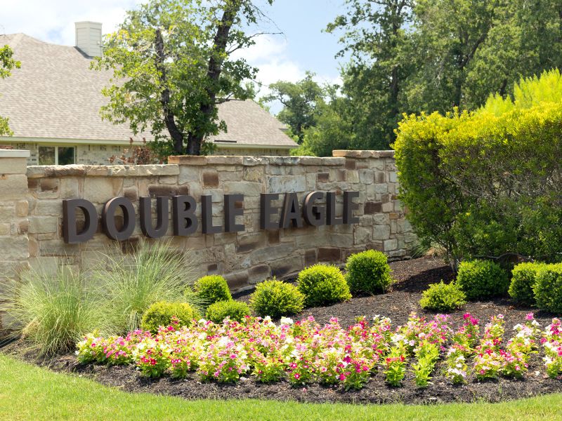 Entrance to the Riverbend at Double Eagle - Reserve Collection community in Cedar Creek, TX, featuring signage and landscaping (Image 2). Entrance to the Riverbend at Double Eagle - Reserve Collection community in Cedar Creek, TX, featuring signage and landscaping (Image 2).