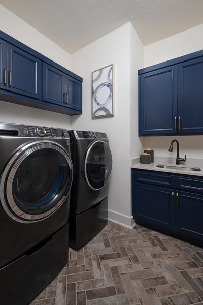 Furnished interior in a model home at Sunday Creek at Kinder Ranch in San Antonio (Image 12).