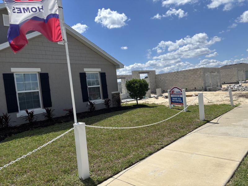 A charming home under construction in Brookhaven by Adams Homes, featuring landscaped grounds in Ocala, FL.