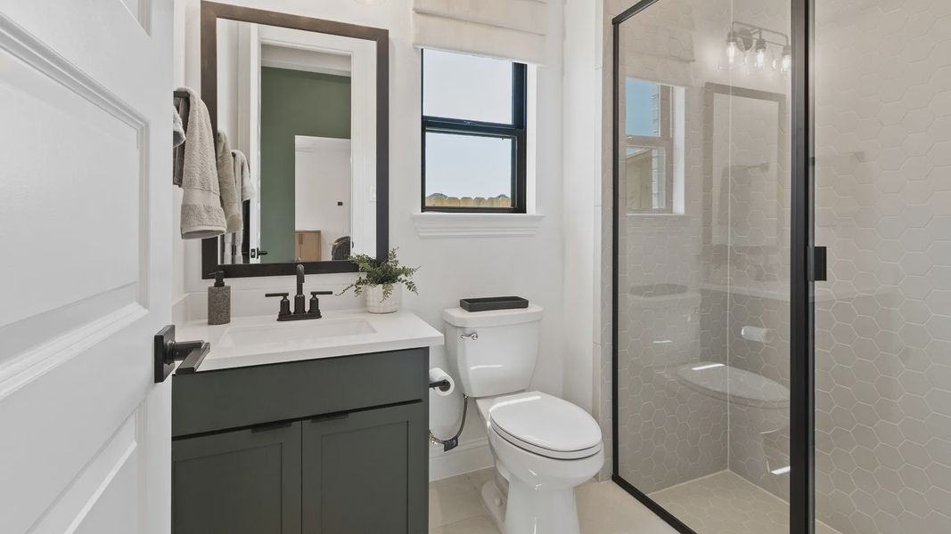 Luxurious hexagonal tiling and sleek fixtures enhance this Oakwood Estates bathroom's refined elegance. Luxurious hexagonal tiling and sleek fixtures enhance this Oakwood Estates bathroom's refined elegance.