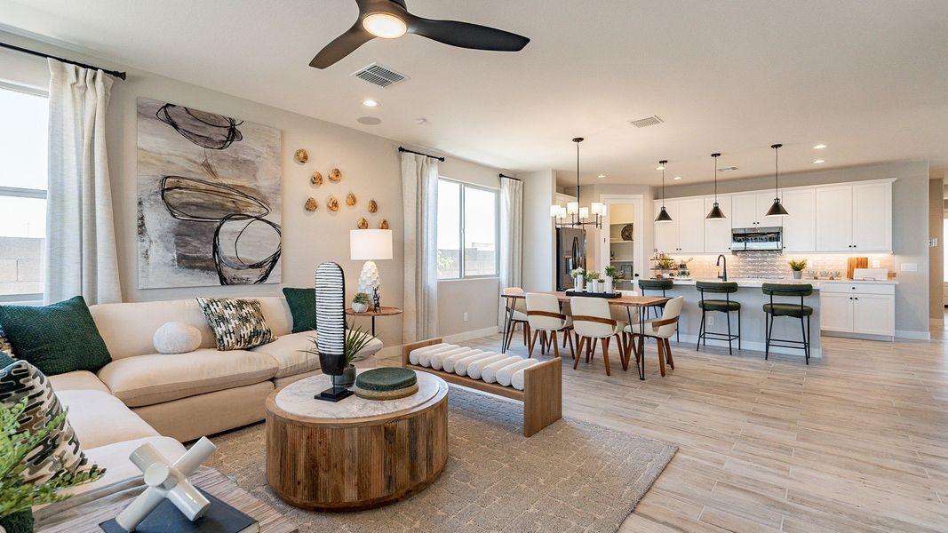 Luxurious open floor plan with elegant finishes, chic décor, and gourmet kitchen in Sienna Park.