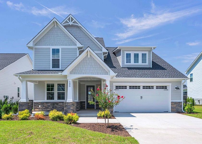 Front exterior of a home in the WyndWater community, located in Hampstead, NC (Image 32).