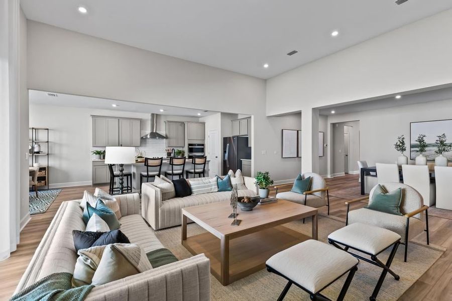 A living room with a large glass wall.