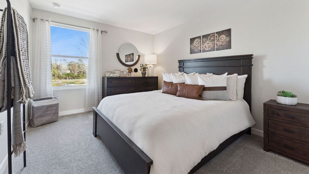 Furnished interior in a model home at Fish Lake Cove in Kissimmee (Image 11).