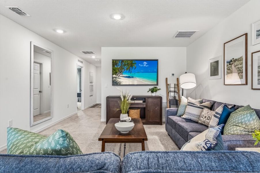 Furnished interior in a model home at Mallard Landing in Okeechobee (Image 4).