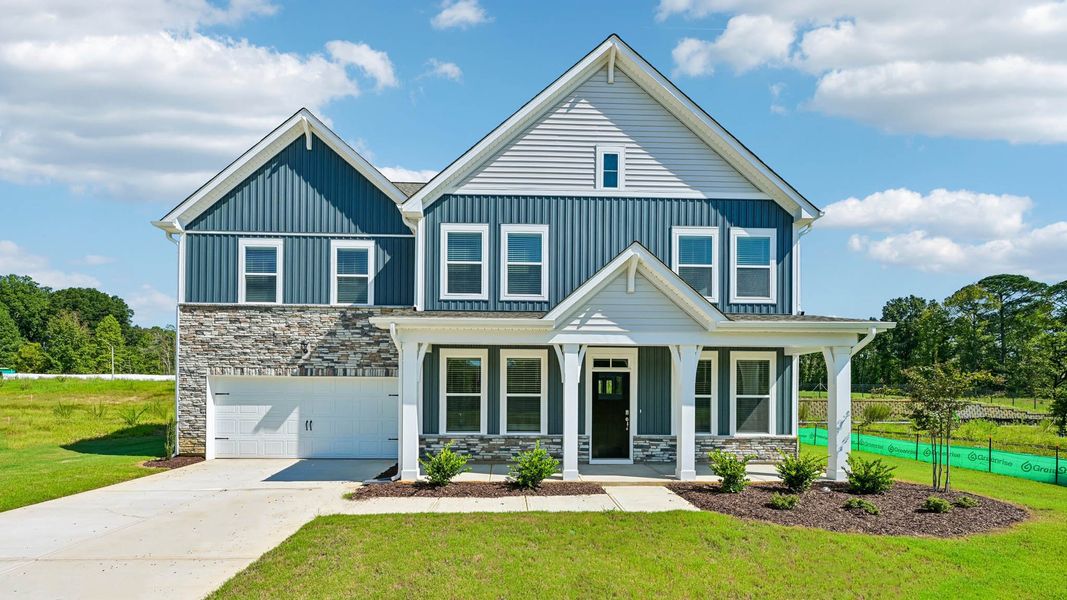 Front exterior of a home in the The Manors at Swift Creek Farm community, located in Clayton, NC (Image 10).