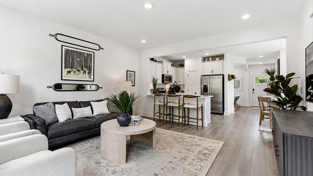 First-rate family room with thoughtful layout and superior connection to kitchen and dining spaces at Clarke Townes First-rate family room with thoughtful layout and superior connection to kitchen and dining spaces at Clarke Townes
