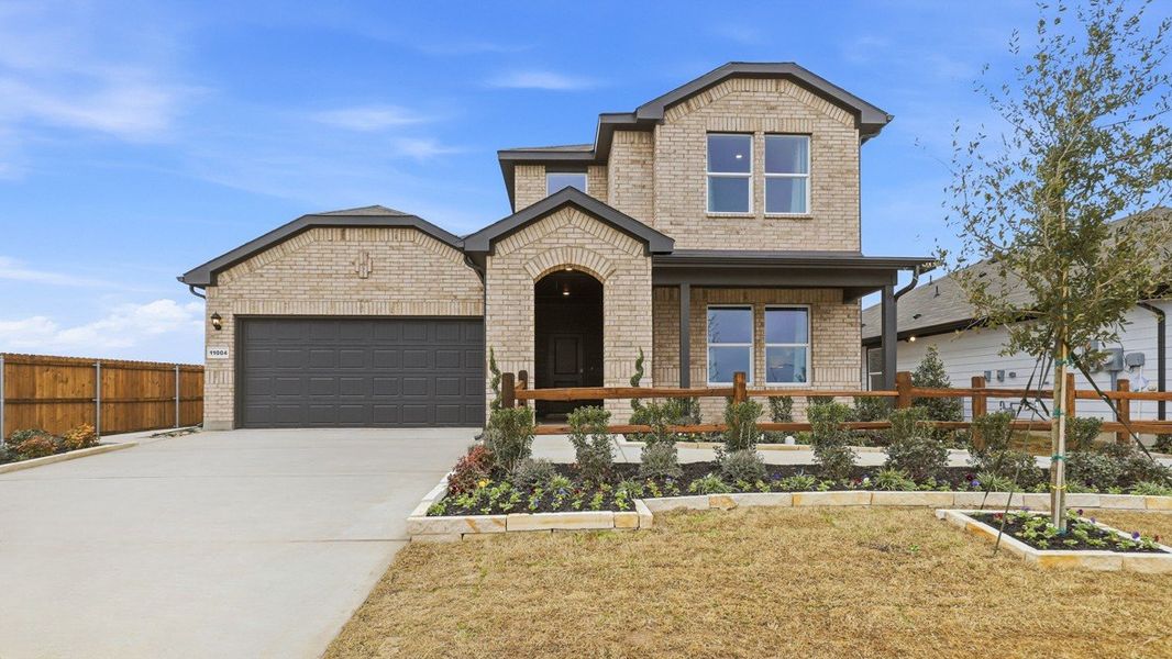 Front exterior of a home in the Longhorn Estates community, located in Fort Worth, TX (Image 2). Front exterior of a home in the Longhorn Estates community, located in Fort Worth, TX (Image 2).
