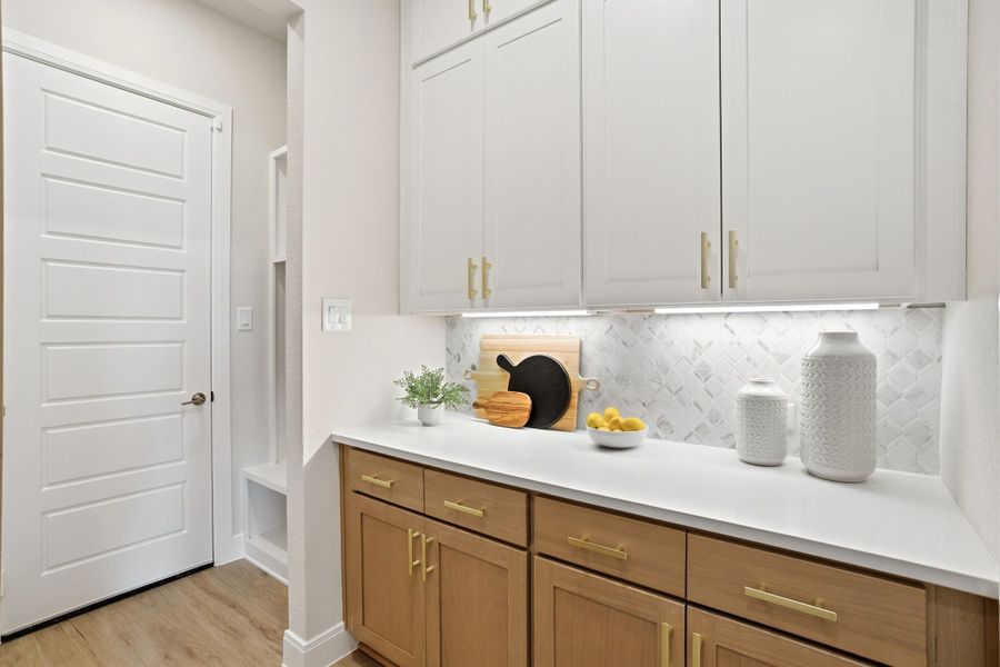 Furnished interior in a model home at Lily Creek at Sutton Fields in Aubrey (Image 35).