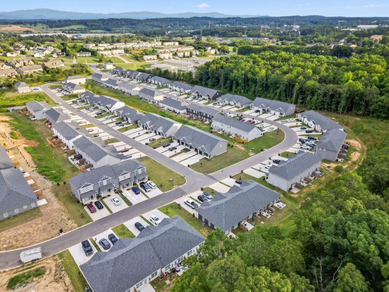 Aerial view of the Bellingham Townhomes community in Cleveland, TN, showing layout and nearby surroundings (Image 14).