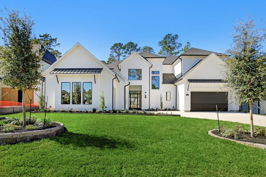 Front exterior of a home in the Carlton Woods Village of Creekside Park community, located in The Woodlands, TX (Image 3). Front exterior of a home in the Carlton Woods Village of Creekside Park community, located in The Woodlands, TX (Image 3).