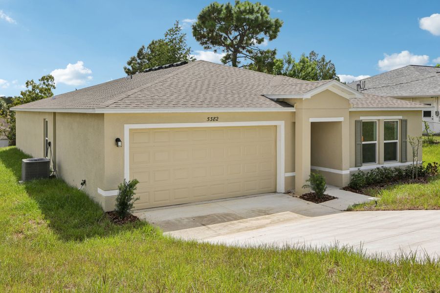 A house with a garage. A house with a garage.