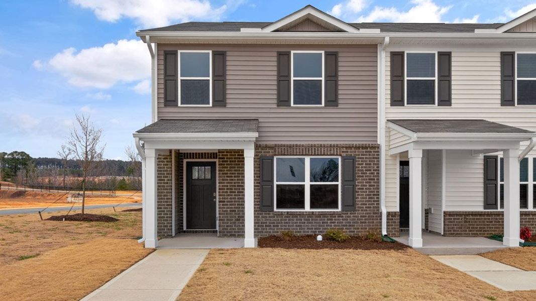 Front exterior of a home in the The Townes at Matthews Landing community, located in Fuquay Varina, NC (Image 11).