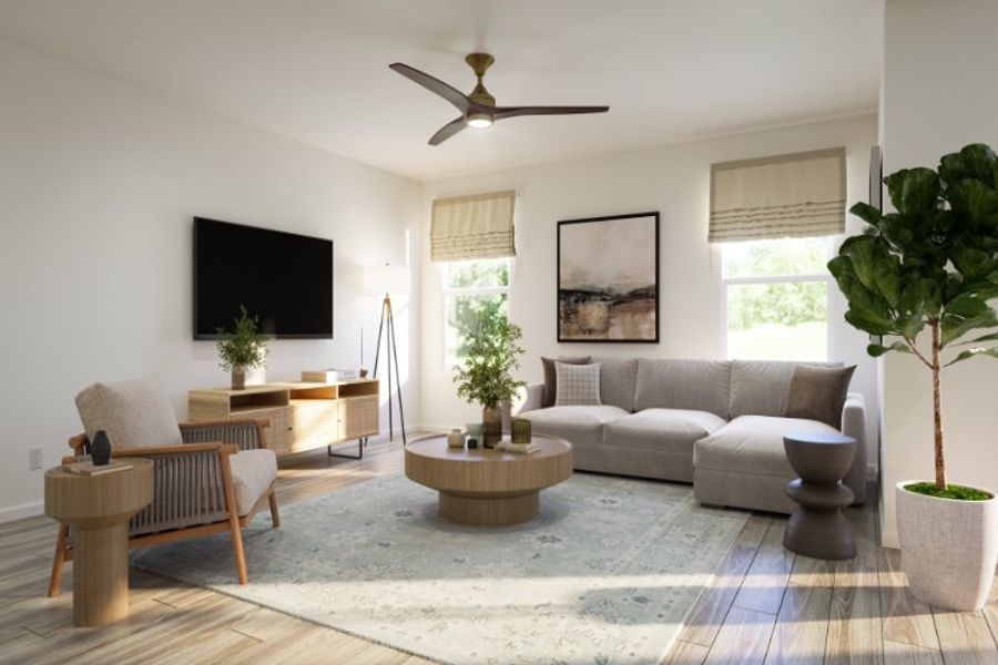 A living room with a tv and couches. A living room with a tv and couches.