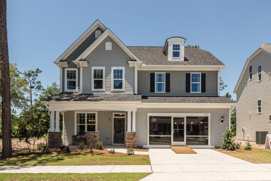 Front exterior of a home in the Laurenbridge - Robuck Homes community, located in Garner, NC (Image 2).