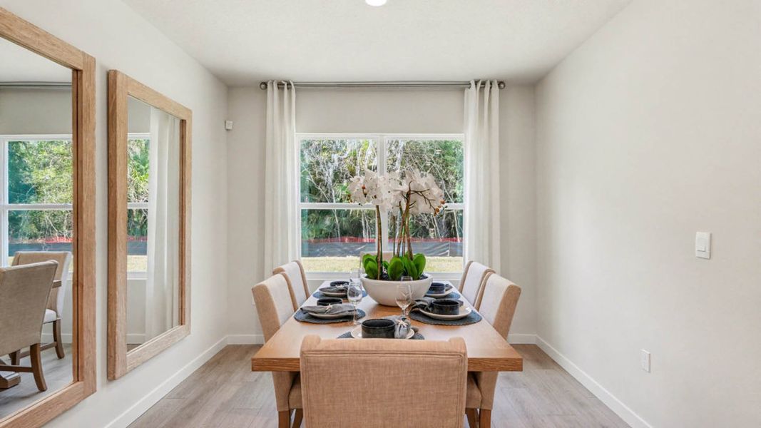 Furnished interior in a model home at Indian River Preserve in Mims (Image 8).