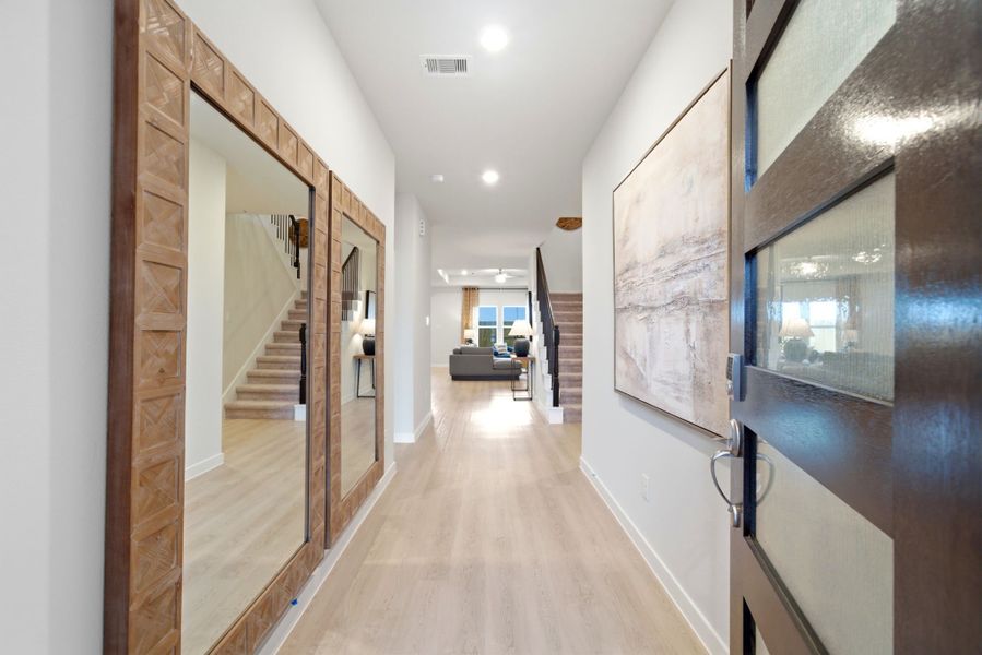 A hallway with glass doors. A hallway with glass doors.