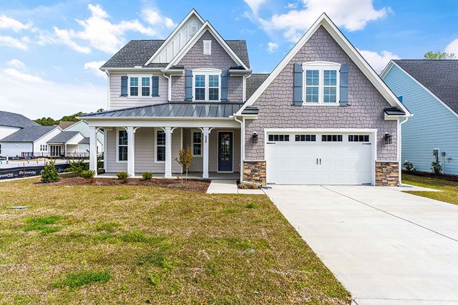 Front exterior of a home in the WyndWater community, located in Hampstead, NC (Image 16).