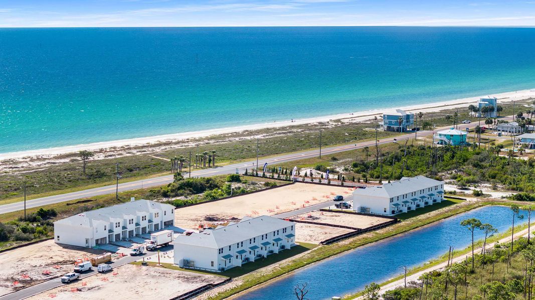 Aerial view of the WindMark Townhomes community in Port Saint Joe, FL, showing layout and nearby surroundings (Image 1).