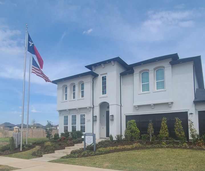 A beautiful modern home with manicured landscaping in Impression 55s by Landon Homes (Frisco, TX).