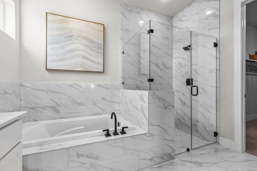 A bathroom with a glass shower.