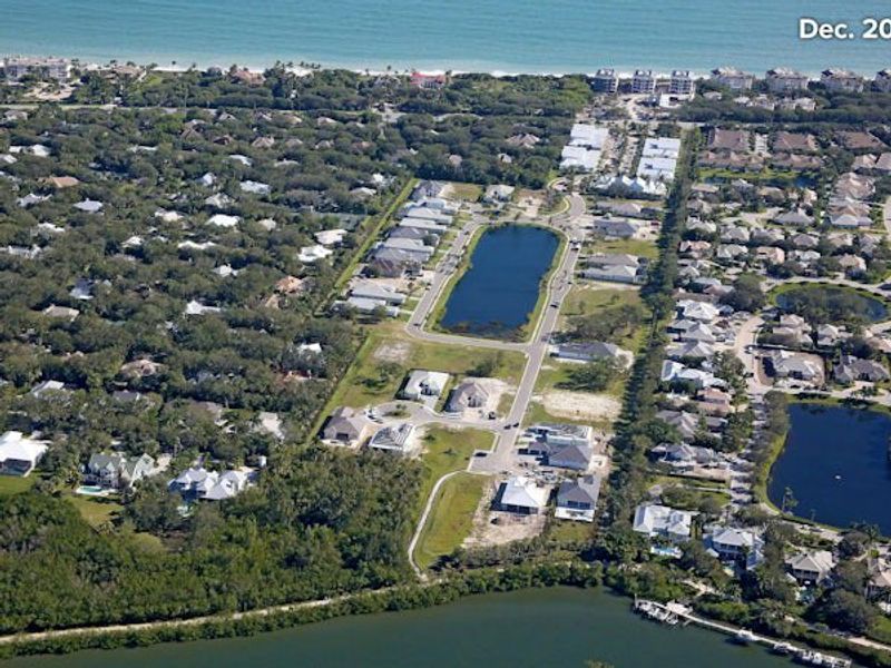Aerial view of the The Strand community in Vero Beach, FL, showing layout and nearby surroundings (Image 22).