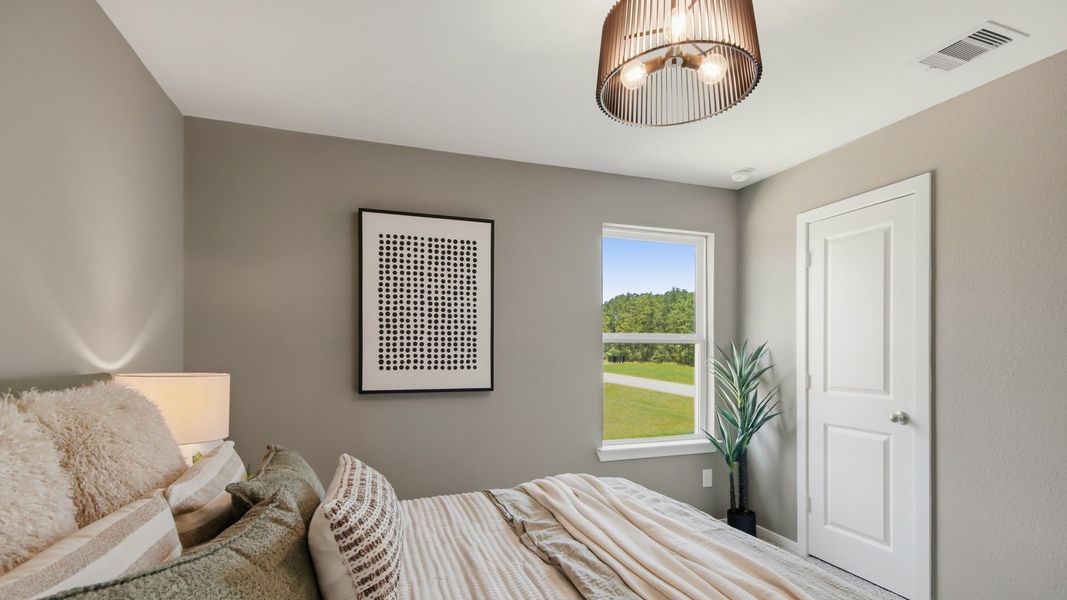 Furnished interior in a model home at East Williams Cove in Conroe (Image 26). Furnished interior in a model home at East Williams Cove in Conroe (Image 26).