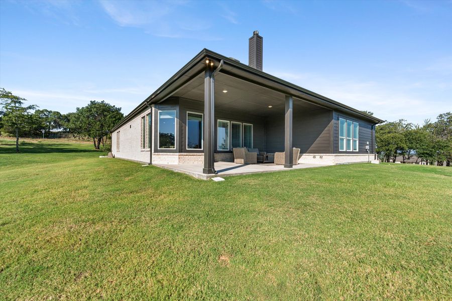 Front exterior of a home in the Oak Grove Addition community, located in Springtown, TX (Image 13).