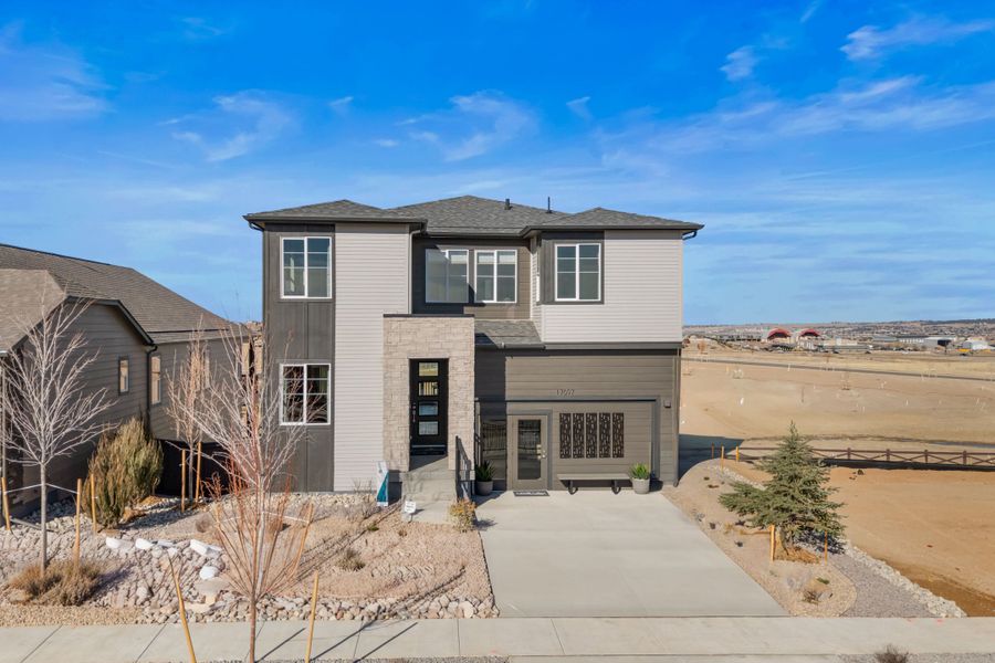 Front exterior of a home in the Trumark Homes at Tanterra community, located in Parker, CO (Image 4).